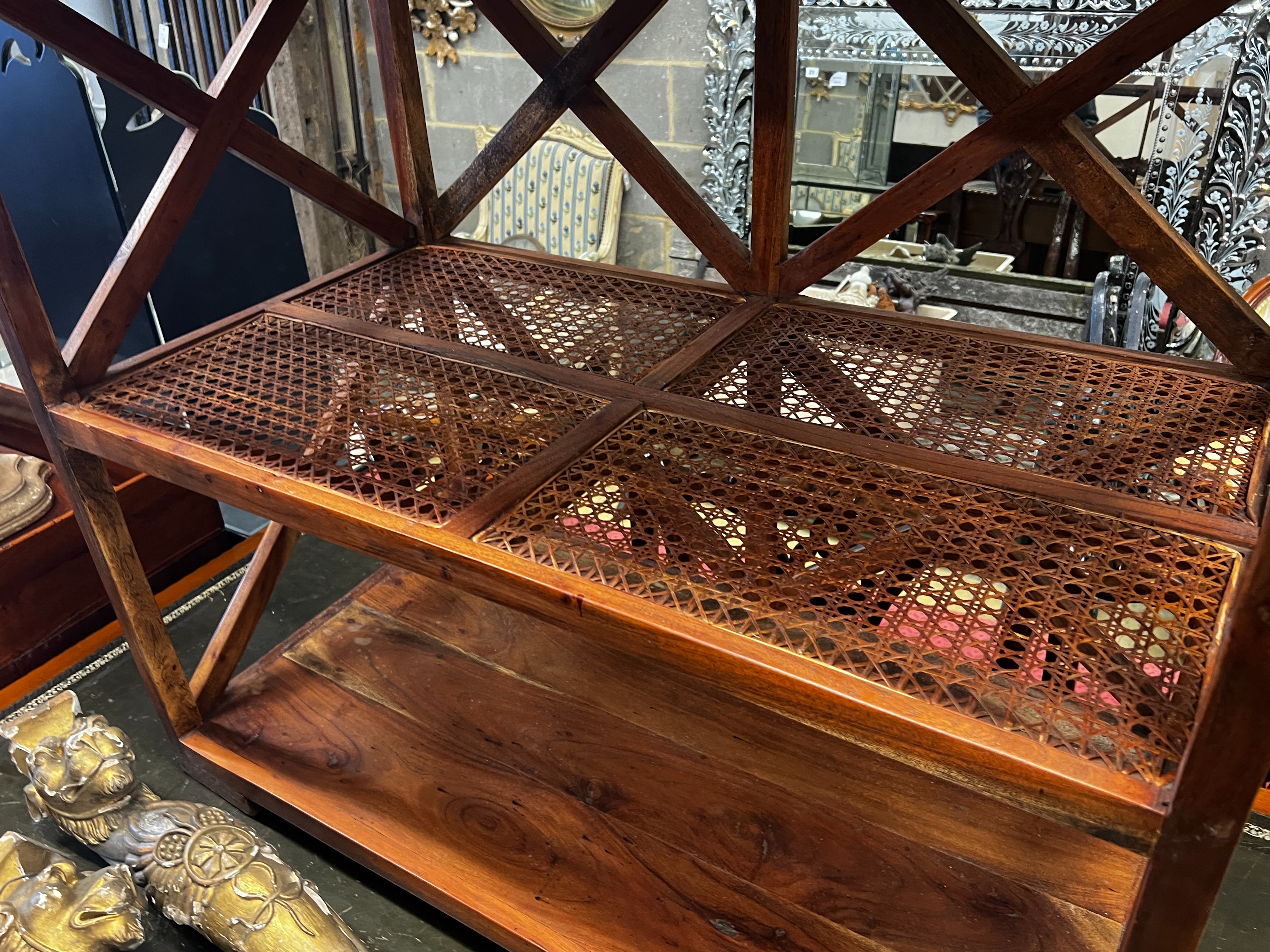 A hardwood and canework tray top three tier table, width 92cm, depth 50cm, height 96cm